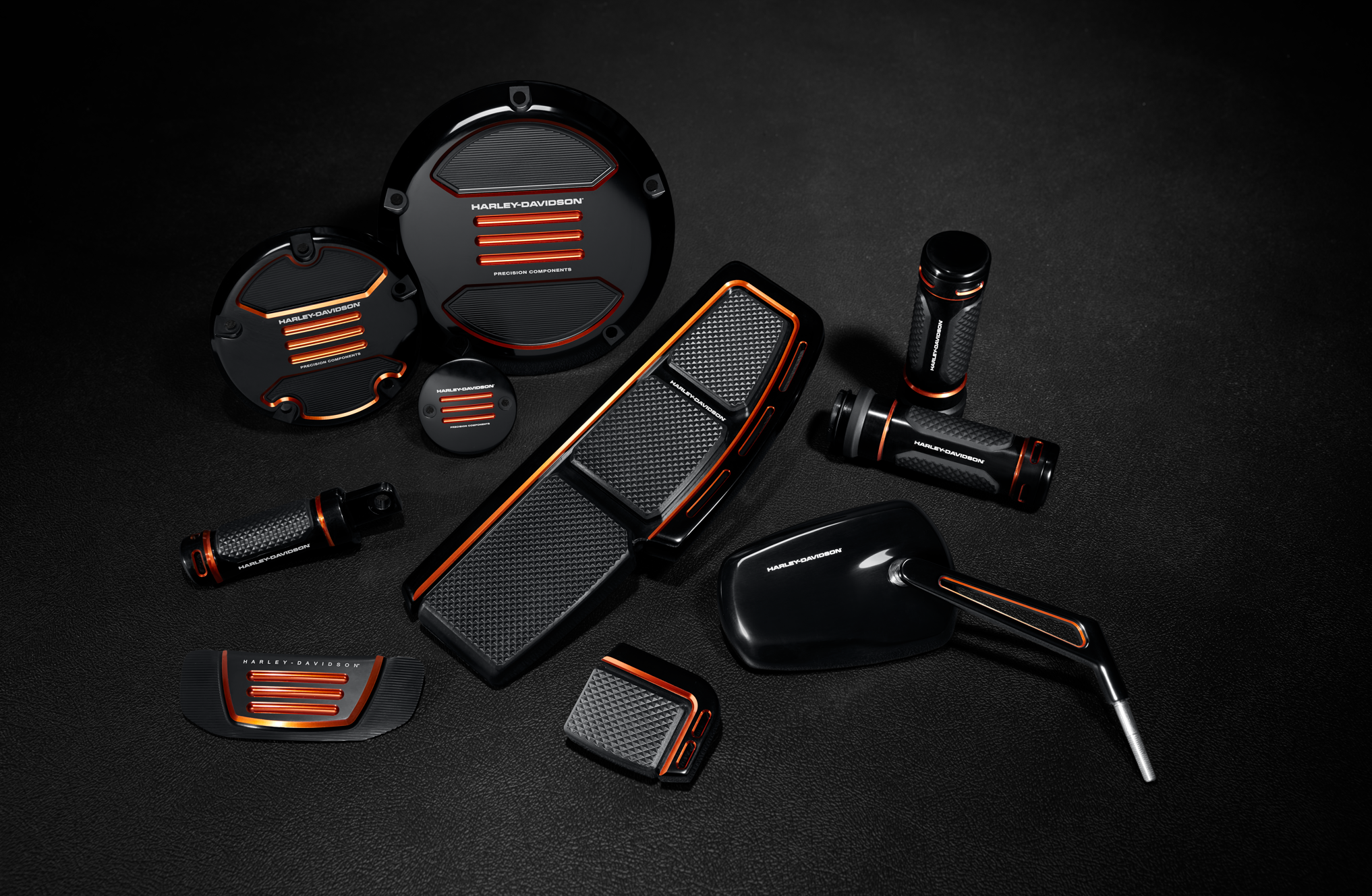 Collection of Harley-Davidson Adversary motorcycle parts on a black background